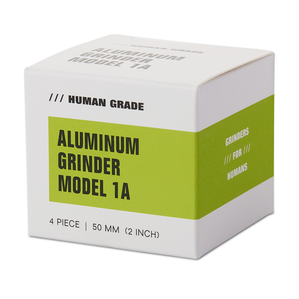 Blue metal grinder with 'Human Grade' branding on a white background