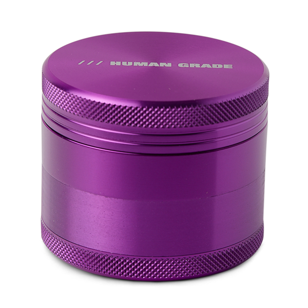 Blue metal grinder with 'Human Grade' branding on a white background