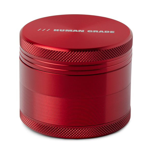 Blue metal grinder with 'Human Grade' branding on a white background