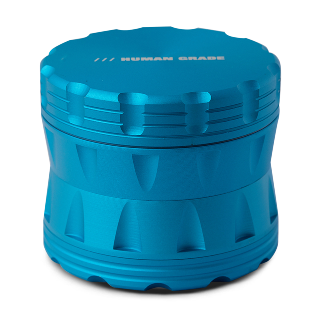 Blue cylindrical container with textured surface on a white background